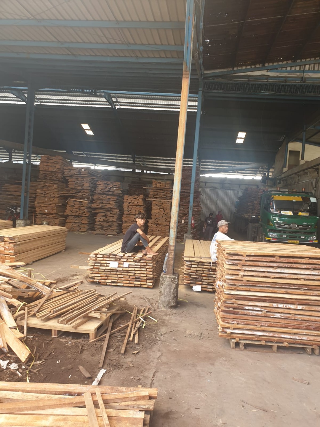Stacked processed lumber in warehouse